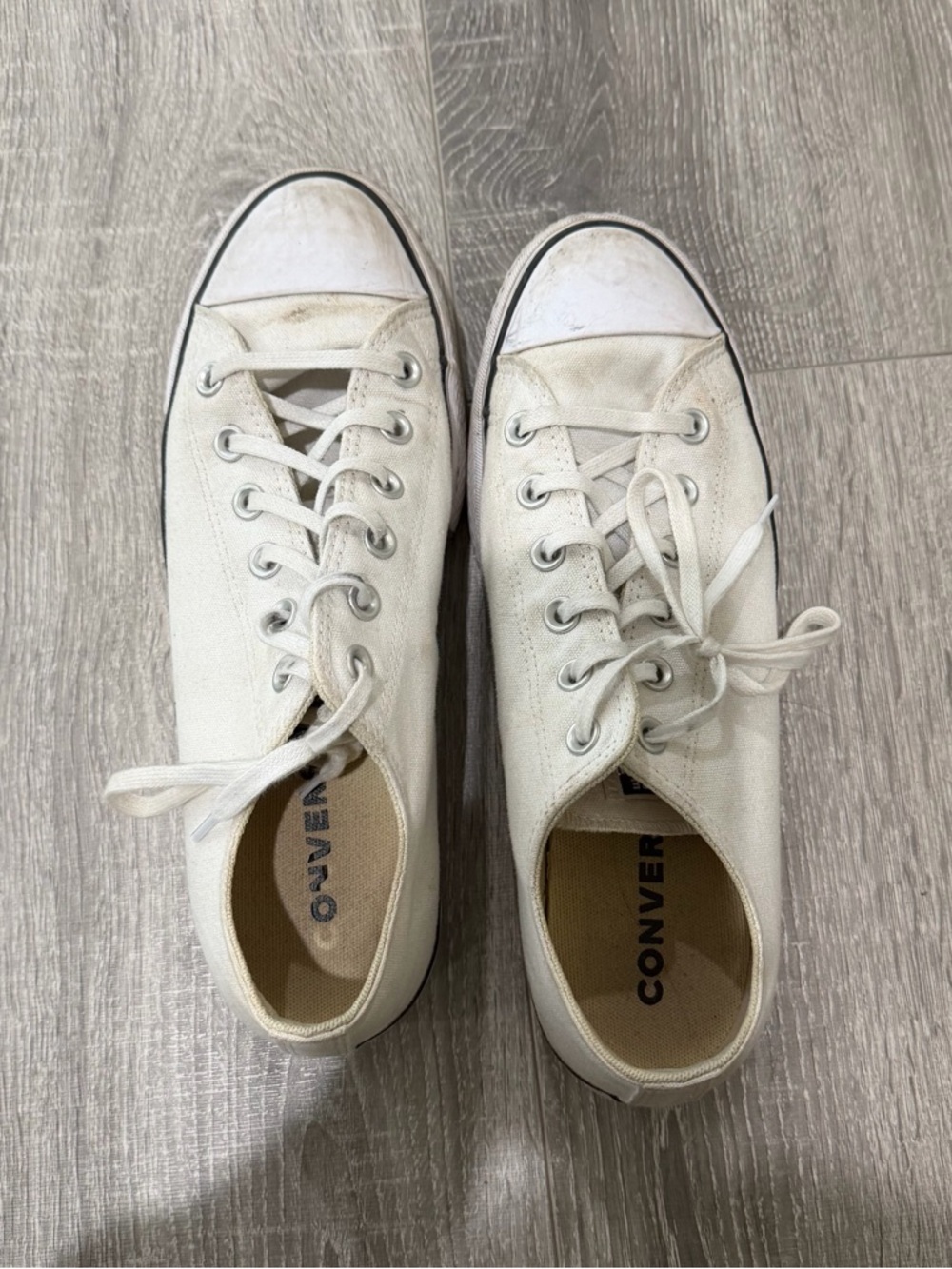 Converse low top sneakers in off-white with black trim